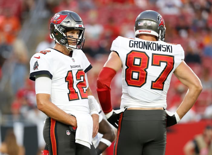 Aug 14, 2021; Tampa, Florida, USA; Tampa Bay Buccaneers quarterback Tom Brady (12) and tight end Rob Gronkowski (87) looks on against the Cincinnati Bengals during the first quarter at Raymond James Stadium. Mandatory Credit: Kim Klement-USA TODAY Sports